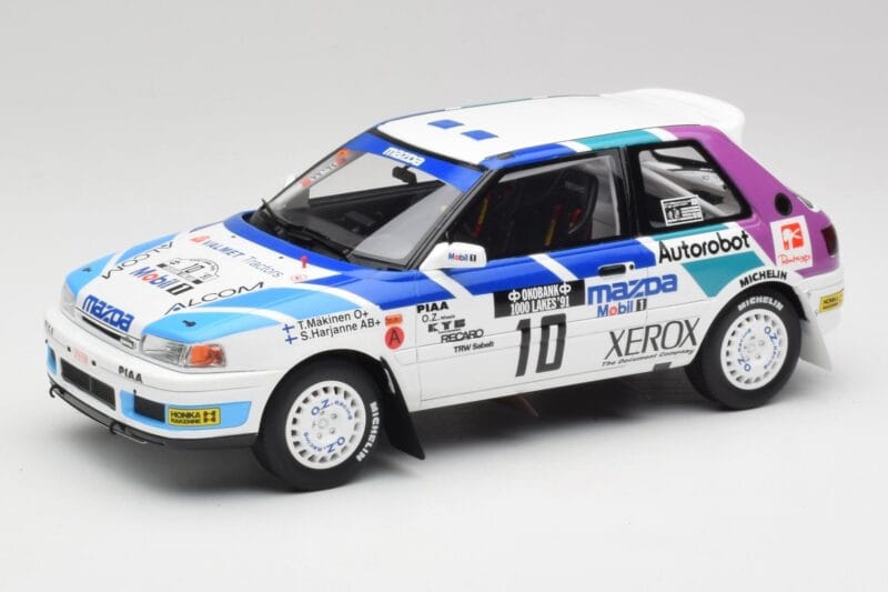 Mazda 323 GTX #10 T. Makinen / S. Harjanne 1000 Lakes Rally 1991 Otto 1:18 OT1099 Živica